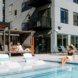 people relaxing by a pool