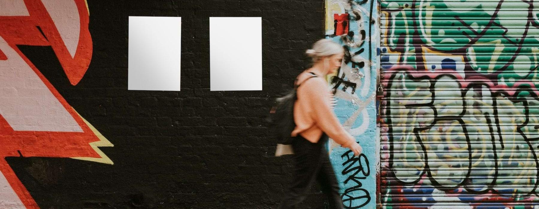a person walking on a sidewalk